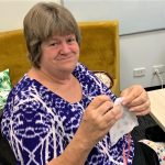 STEPS volunteer Kerri Robert sews